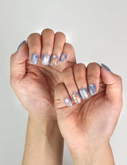 Aqua Flash Singapore press on nails styled with summer outfit, showing glossy bold design