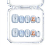 Aqua Flash Singapore press on nails with blue base, ribbon accents, and bear patterns by naillover