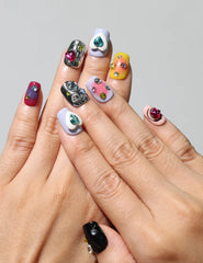 Model wearing colorful coffin Singapore press on nails with heart gems – handmade by naillover