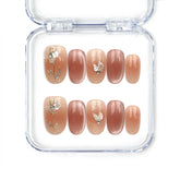 Naillover Autumn Whisper handmade press on nails in nude-to-brown ombre with gold foil and leaf motifs from Singapore press on nails collection.