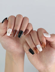 Close-up of fingers styled with Naillover Blend Black press on nails, highlighting classic color mix and luxury finish.