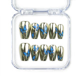 Blue Aura Singapore press on nails by naillover, featuring handmade golden sheen nails with 3D blue butterfly accents in a trendy summer design.