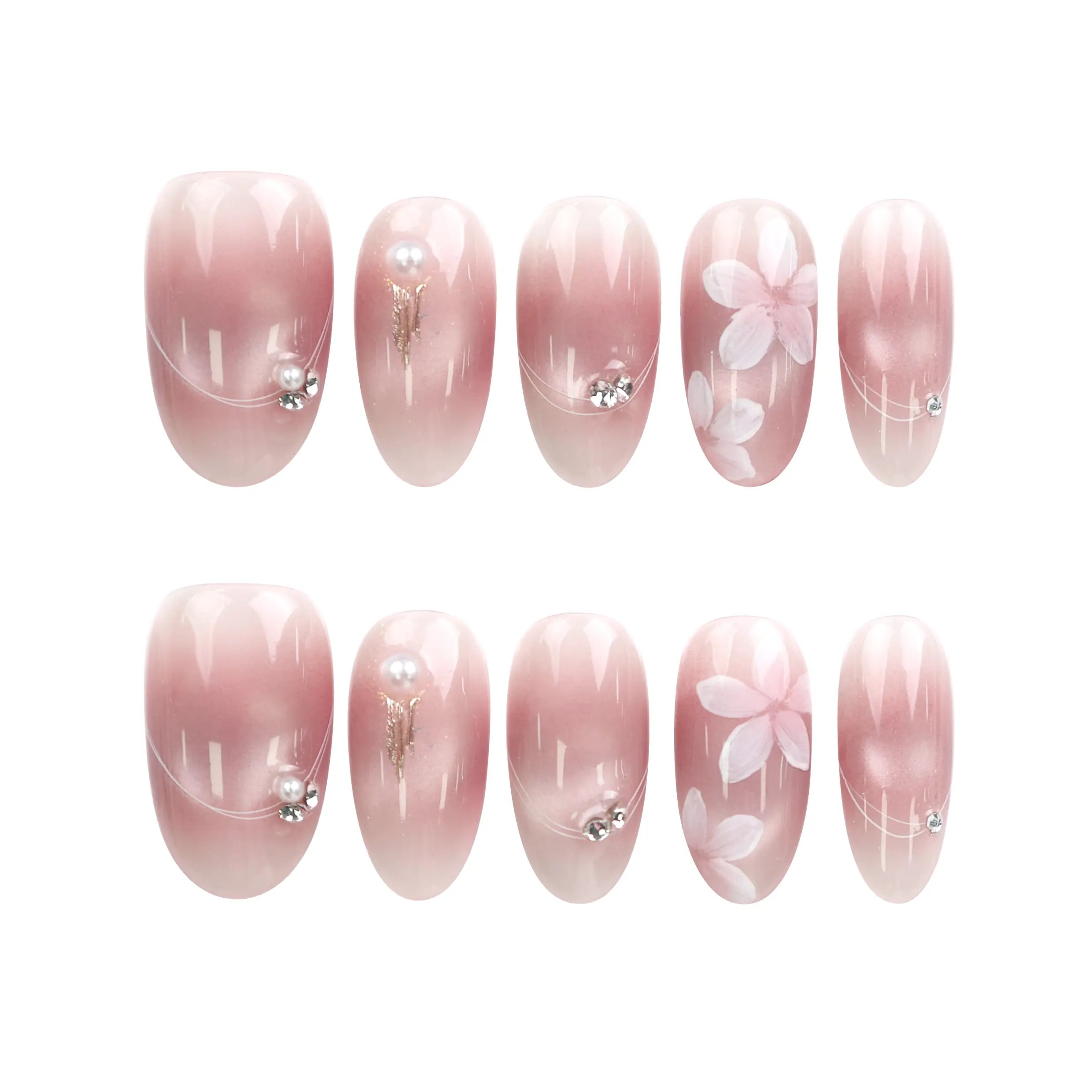 Blush Blossom Sparkle Singapore press on nails arranged on white background, showing pink translucent base, white flowers, and metallic details.