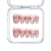 Blush Blossom Sparkle Singapore press on nails with soft translucent pink base, white floral patterns, and metallic accents, handmade by naillover for a trendy and elegant look.