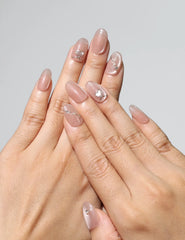 Model wearing Blush Gleam Cat Eye Singapore press on nails with silver shimmer accents – naillover handmade design.
