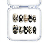 Short oval handmade press-on nails with cartoon prints and glossy finish from Naillover’s Singapore collection.