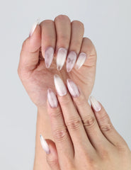 Close-up of Naillover’s handmade nails featuring romantic pink tones, subtle gradient, and 3D butterfly charms