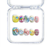 Naillover handmade short Singapore press on nails with pastel pink and blue ice cream and gummy bear details.