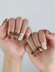 Side view of hand with Caramel Luxe handmade press on nails, showing the sleek classic finish and brown-gold gradient.