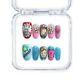 Colorful short oval press-on nails with doodles, smiley faces, and pop graphics from Singapore brand Naillover.