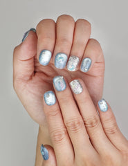 Close-up of Naillover Celestial Blue Singapore press on nails showing metallic accents and bold trendy nails design.