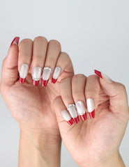 Side view of coffin press-on nails in red with silver glitter ombré, showcasing dramatic sparkle and length