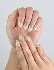 Close-up of Clean Sand Singapore handmade press on nails, highlighting cream tones and linear art accents.