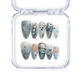 Naillover Singapore handmade press on nails in blue almond shape with pearly shimmer and 3D crystal accents