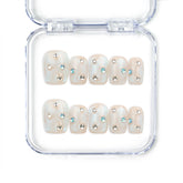 Crystal Dust nude short Singapore press on nails with shimmering finish and gem accents, handmade by naillover for a classic and elegant style