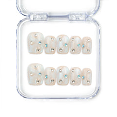 Crystal Dust nude short Singapore press on nails with shimmering finish and gem accents, handmade by naillover for a classic and elegant style