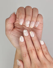 Close-up of Naillover Crystal Sparkle Singapore press on nails showing shimmering cat eye effect with subtle colorful accents.