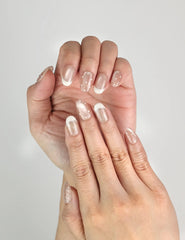 Close-up of Dewdrop Delight nude shimmer Singapore press on nails on model’s hands