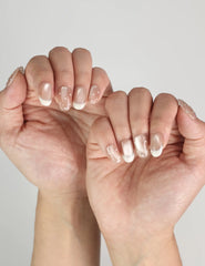 Elegant manicure featuring Dewdrop Delight handmade Singapore press on nails with sheer nude tone