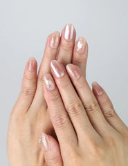 Hand gesture featuring short press on nails in pastel pink with a soft morning glow finish, handmade in Singapore by Naillover