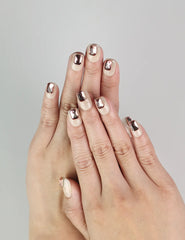 Hand wearing Dream Glitter beige press-on nails with pink rhinestones, handmade by naillover, trendy nails Singapore