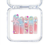 Singapore handmade long pipe press on nails with pastel pink, blue, yellow, green, and 3D shell and starfish nail art by Naillover