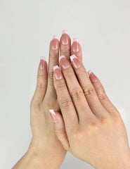 Model wearing Dusky Pink handmade Singapore press on nails with glossy muted pink finish, classic simple nails design by naillover