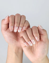 Side view of short oval nails with elegant 3D floral designs, perfect for bridal or romantic looks