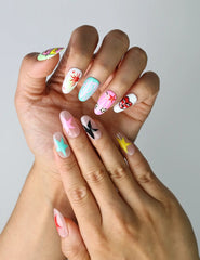 Close-up of Naillover’s handmade cat-themed nails featuring dreamy colors, twinkling stars, and kawaii feline designs
