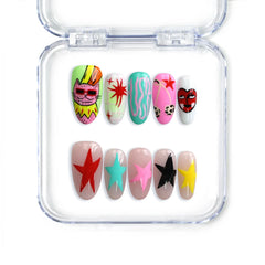 Medium almond Singapore press on nails with blue and pink pastel tones, cartoon cats, and starry graphics by Naillover.