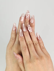 Close-up of Floral Flicker Singapore press on nails by naillover, floral patterns with glitter and crystals for a chic coquette style.