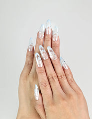 Hand wearing Frost White Singapore press-on nails with silver glitter accents, handmade by naillover