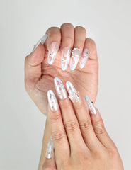 Model showing Frost White handmade Singapore press-on nails with delicate silver glitter, by naillover