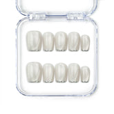 Close-up of NailLover Frosted Glare handmade press on nails in silver shimmer with cat eye effect on white background