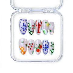 Singapore almond press on nails with cherries, daisies, and pastel floral patterns, handmade by Naillover