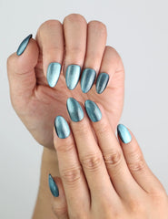 Close-up of Galaxy Gleam Singapore press on nails with handmade star-like glitter on fingertips.