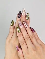 Model wearing Glossy Love coquette nails with glossy red and pink hearts, Naillover handmade Singapore press on nails.