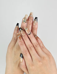 Model wearing Gold Tips Singapore press on nails with nude base and gold pearl accents – handmade by naillover