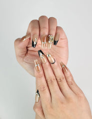 Close-up of Gold Tips Singapore press on nails featuring gold accents, pearls, and shimmering stones – naillover handmade design