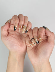 Elegant manicure with Gold Tips Singapore press on nails in nude and gold, perfect for weddings or formal events – by naillover