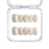 Singapore handmade short press on nails in pale pink with delicate gold lines and subtle shimmer by Naillover