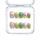 Gradient heart handmade press on nails in pastel colors with cat-eye heart details by naillover, Singapore press on nails