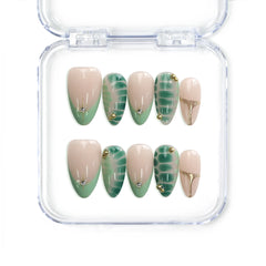 Naillover Singapore handmade short almond nails in nude and green tones with tropical leaf art and gold accents