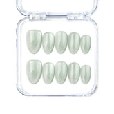 Naillover Jade Curve handmade Singapore press on nails in almond shape with jade green cat eye shimmer finish.