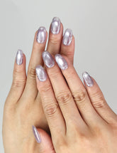 Naillover Lavender Sparkle press on nails worn on hand, showing lavender cat eye shine with glitter accents