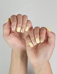 Natural light shot of Lemon Zest Singapore press on nails, playful ombre nails for summer vibes by naillover