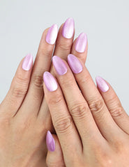 Hand wearing Lilac Sparkle lavender press on nails with soft cat eye glow by Naillover.