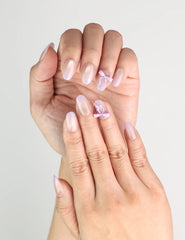Close-up of Naillover Lilac Whisper handmade Singapore press on nails with delicate lavender ribbon details