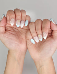 Naillover Marine Dream trendy nails styled on hand, showcasing handmade pastel nails with shimmer and gold embellishments.