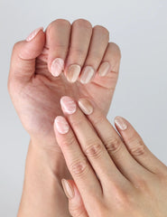 Side angle view of Mellow Marble press on nails by Naillover with fluid color blending and natural nail shape.